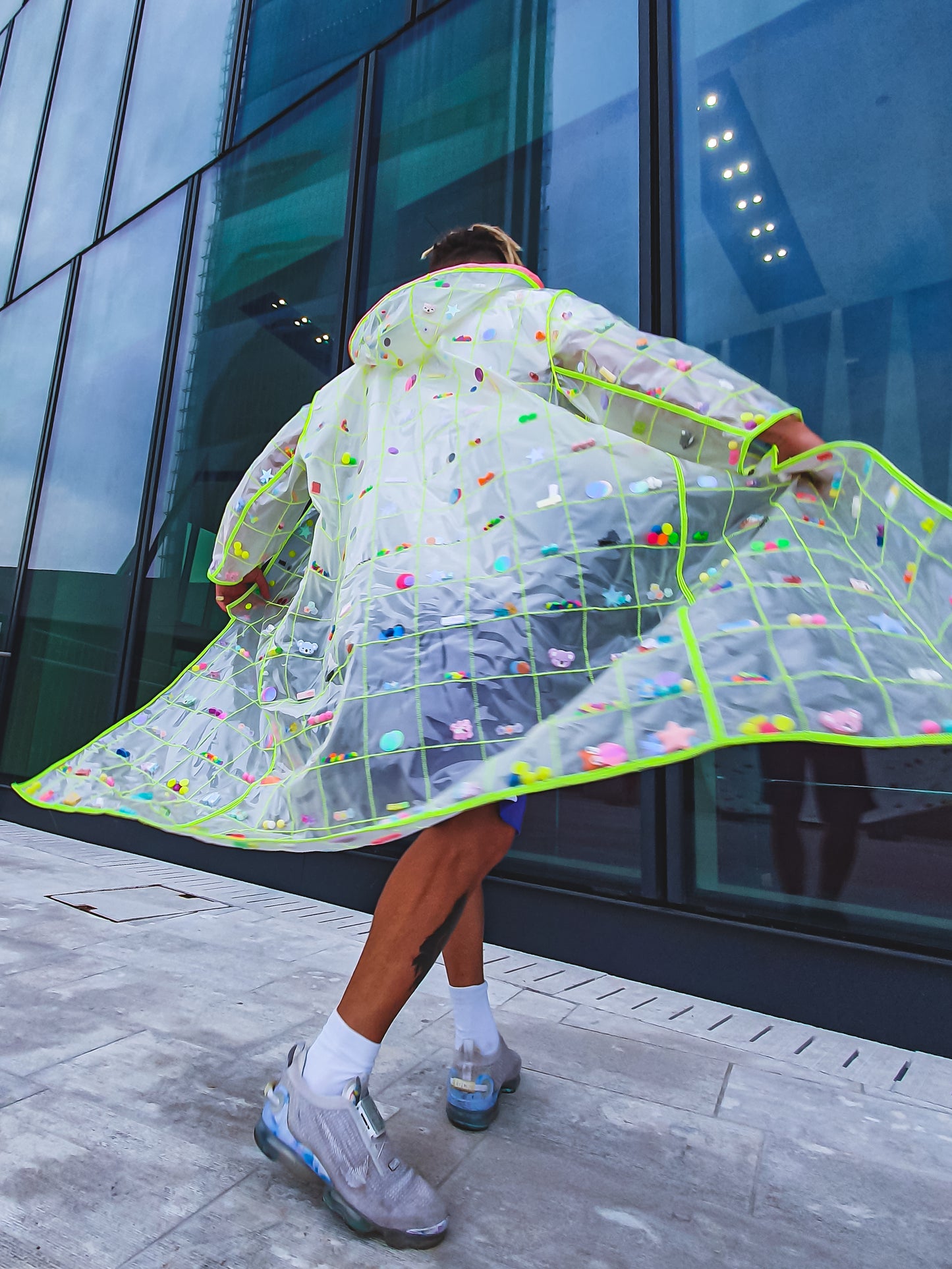 mans fashion transparent raincoat street style of independent fashion brand